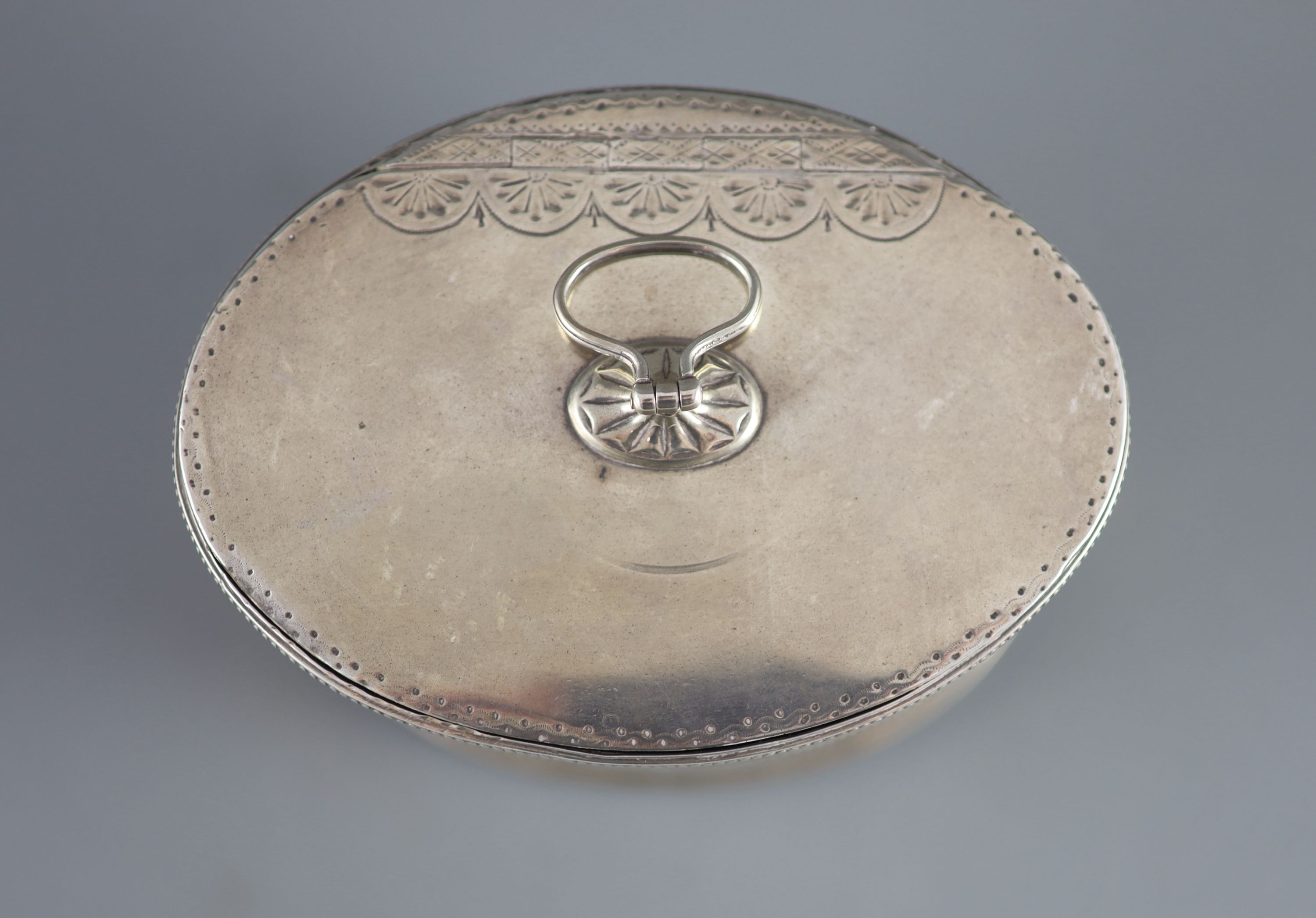 A George III silver oval tea caddy by John Younge & Co